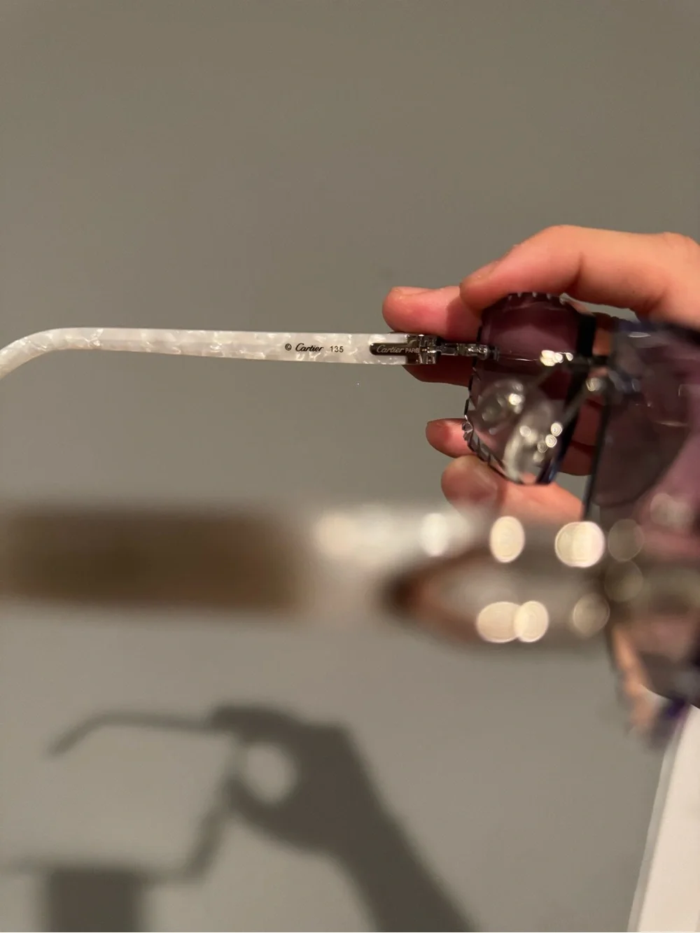 Cartier Rimless Sunglasses with White Marble Temples and Gradient Purple Lenses
